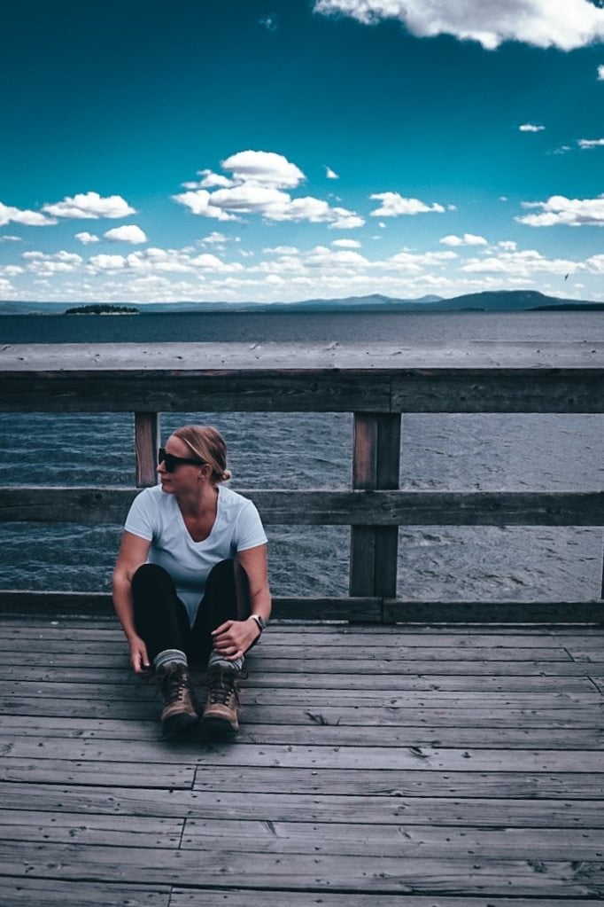 Woman sitting at Yellowstone Lake