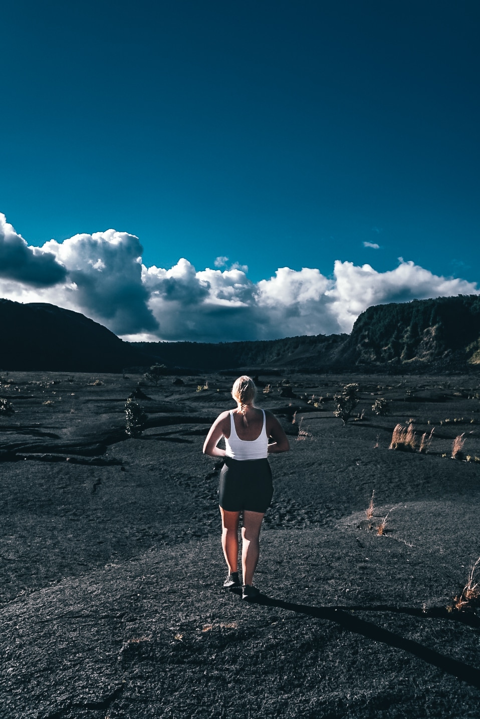 Woman standing in the middle of Kilauea Iki crater