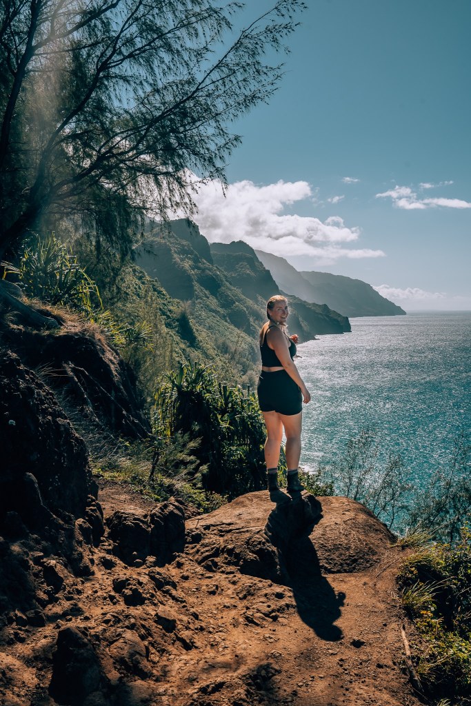 Woman looking out at the Kalalau Lookout viewpoint
