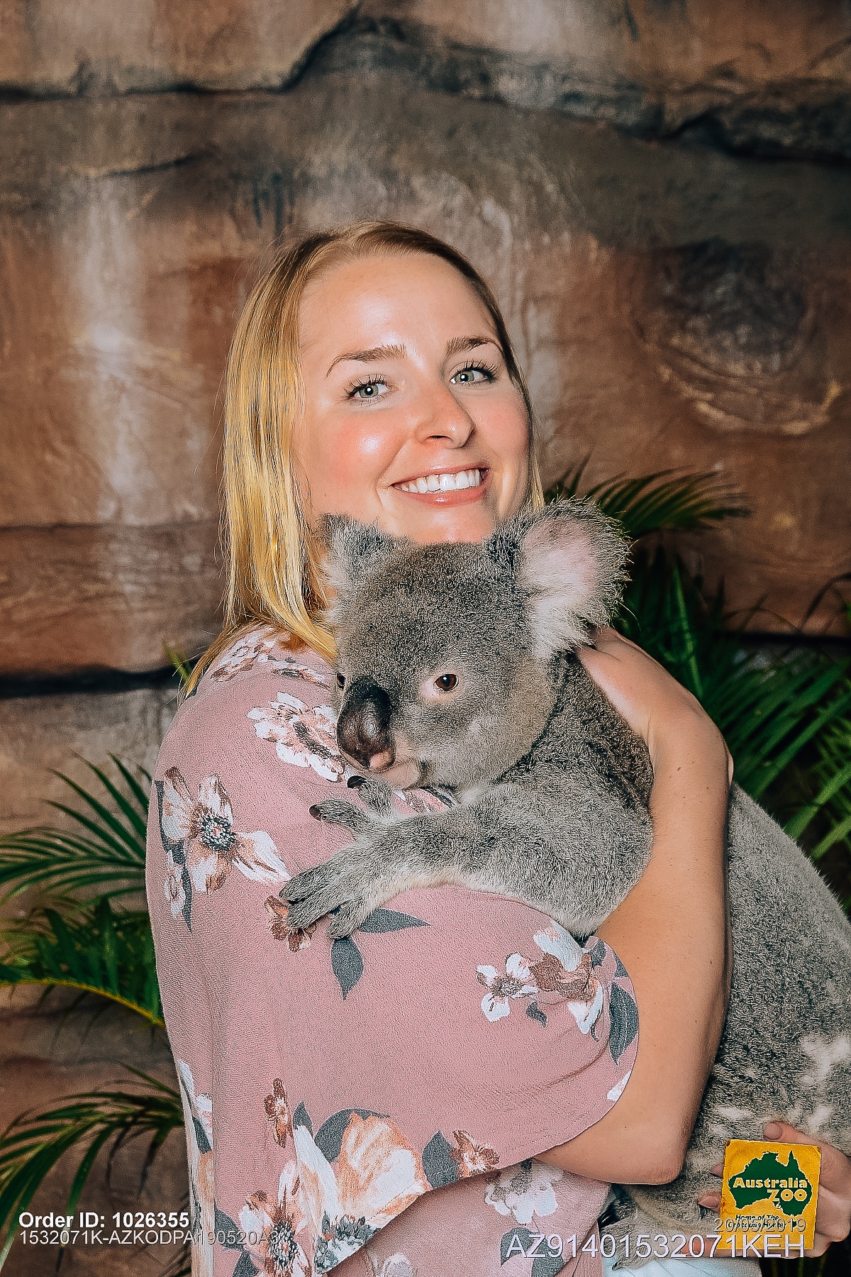 Woman holding a koala at the Australia Zoo