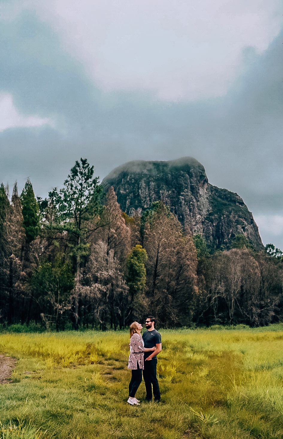 Couple standing in front of Glass Mountains in Australia