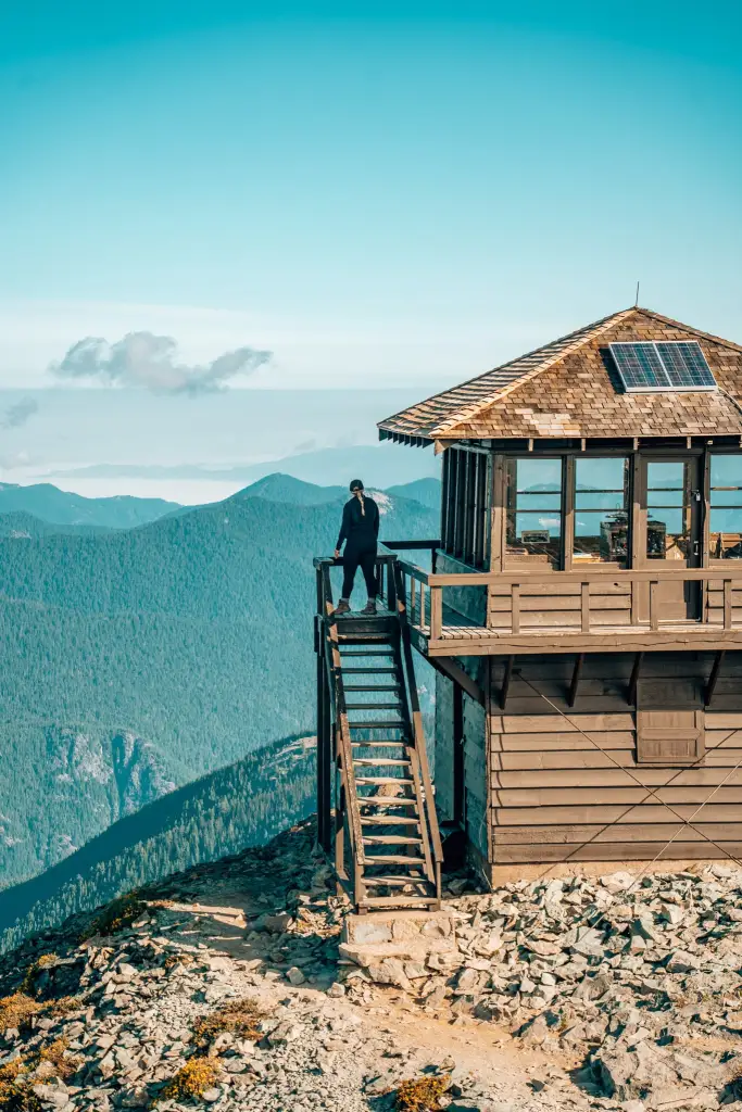 Woman standing on the Mount Fremont fire lookout in Mount Rainier National Park