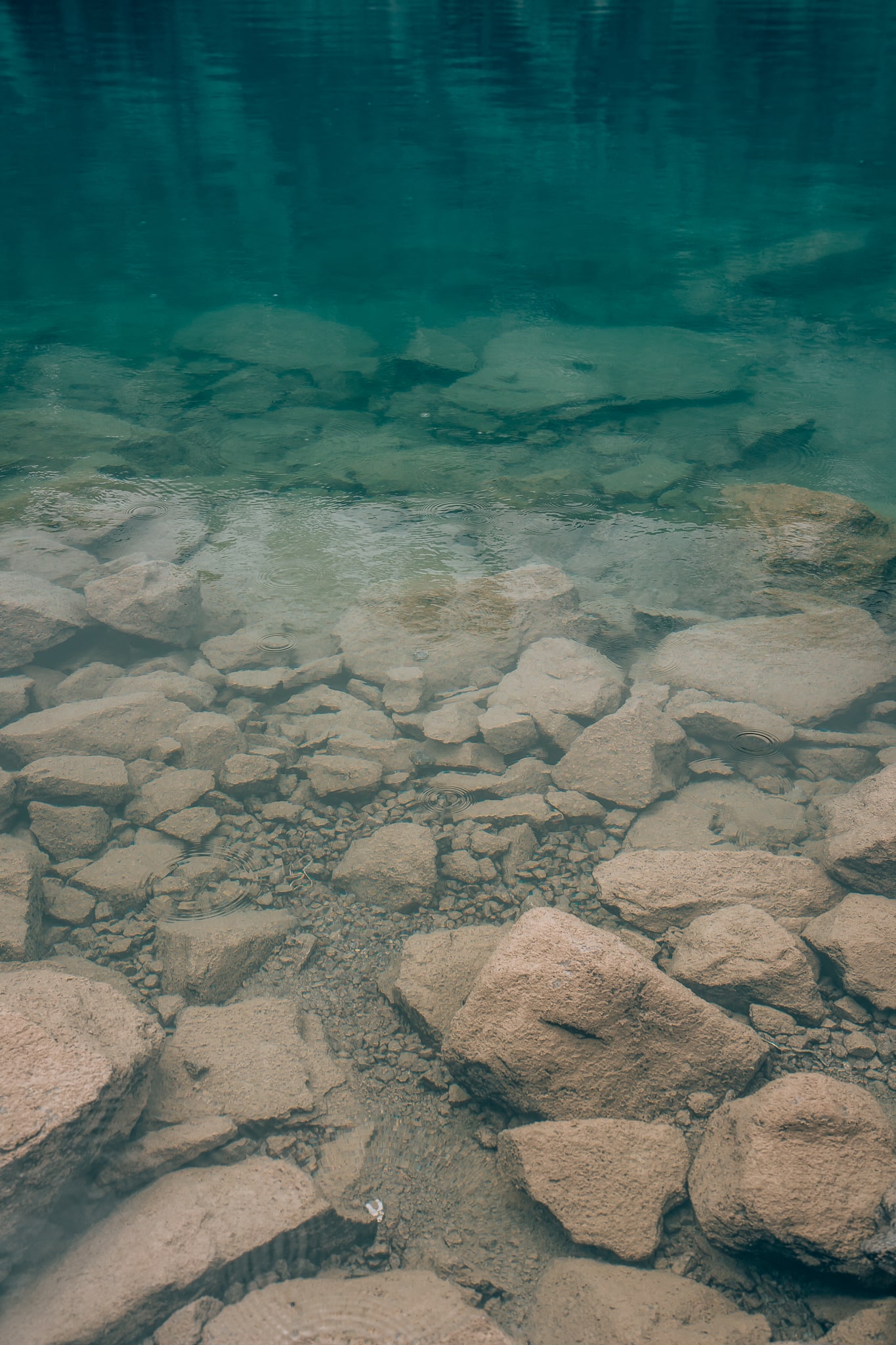 Up close shot of the super clear and super blue water at Laguna 69 in Huascaran National Park in Peru
