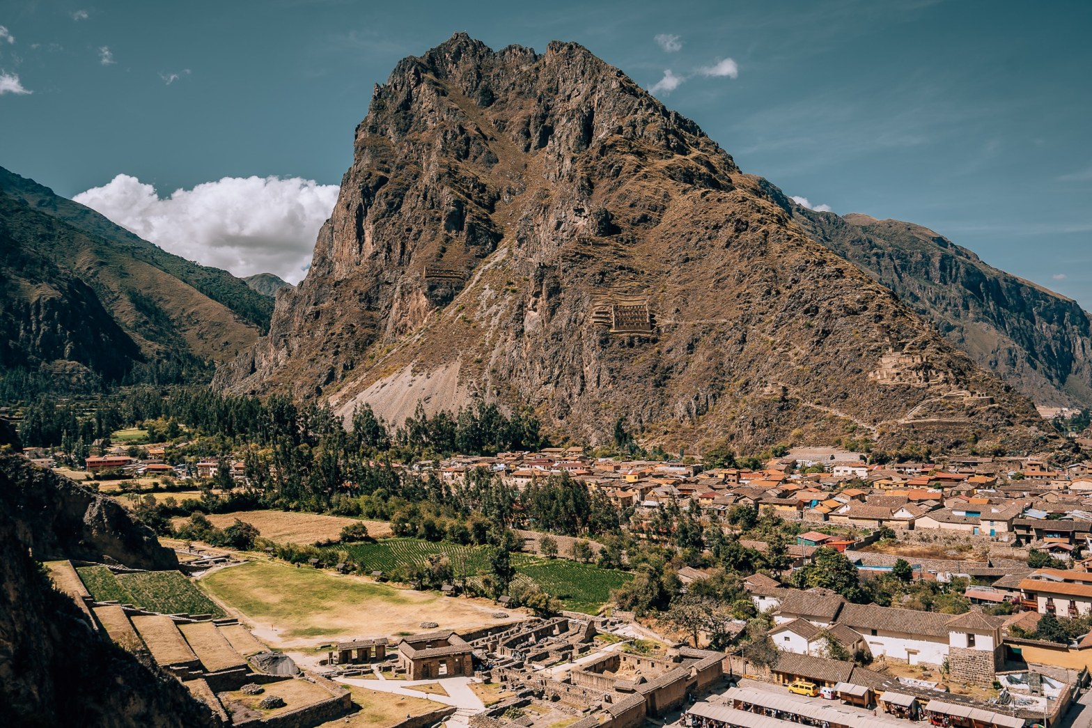 Giant mountain sticking out of the small town of Ollantaytambo
