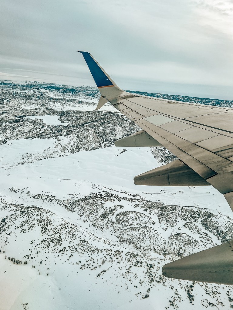View from the window seat over snowy mountains