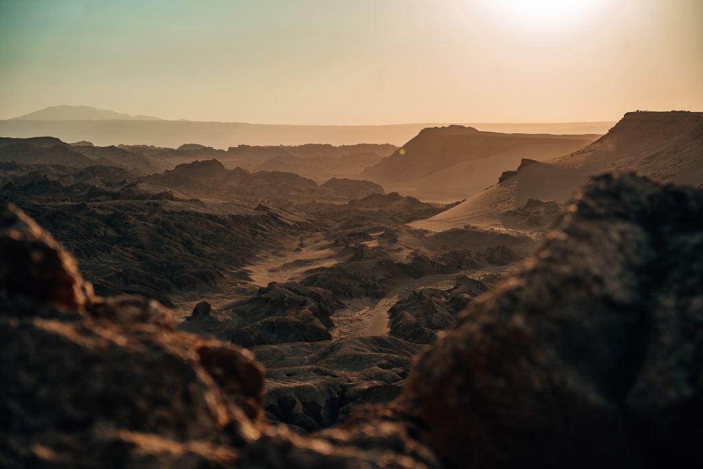 Sand and rock basin under a sunset in the Atacama Desert