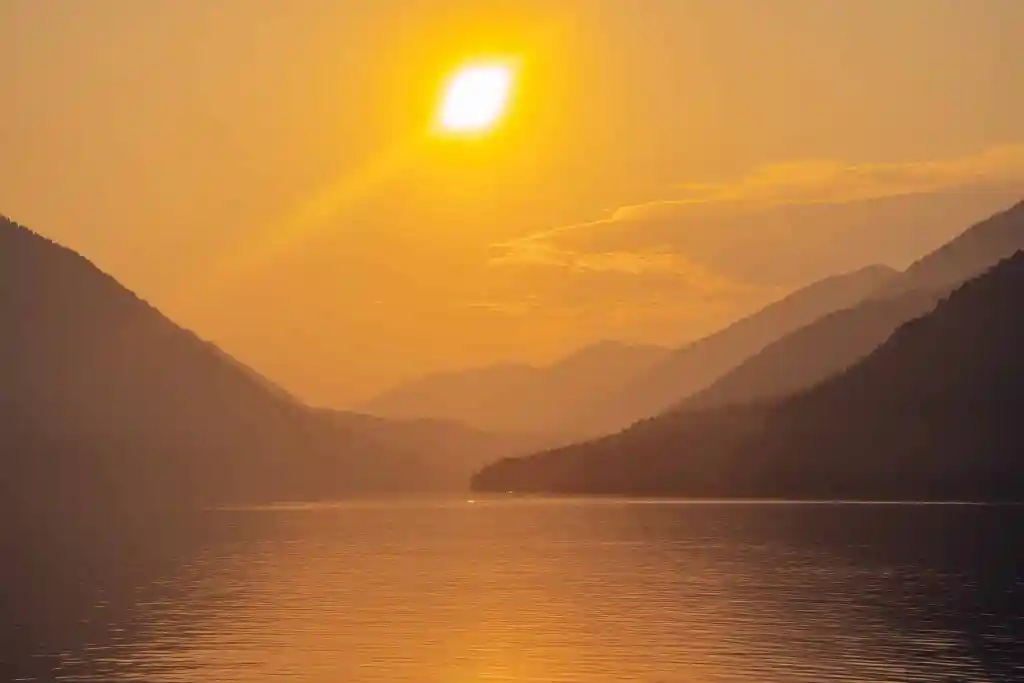 Sunset at Lake Crescent at Olympic National Park; mountains fading and layering in the background