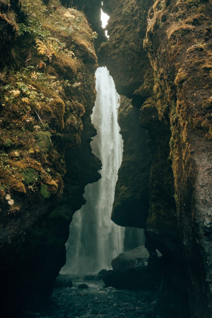 View of Iceland's Gjufrabrai waterfall behind the walls of a canyon