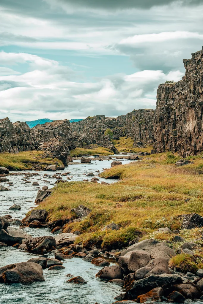 River running through Thingvellir National Park with the plates shooting up on the right side